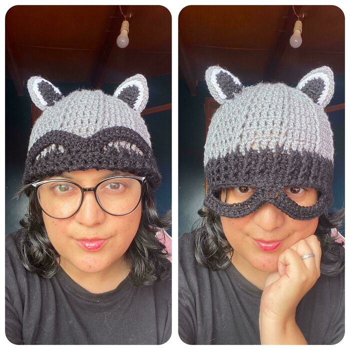 A person models a crocheted raccoon hat. The left shows the hat above glasses; the right shows the hat's mask covering eyes. Crocheted awesome.