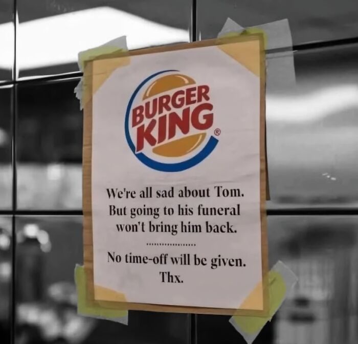 Burger King sign humorously denying time off for an employee's funeral, a bizarre and hilarious unusual workplace notice.