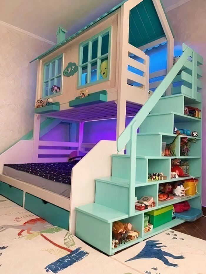 Children’s bunk bed with built-in staircase and shelves, showcasing talented woodworking and smooth craftsmanship in a playful design.