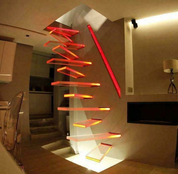 Floating zigzag stairs with glowing red edges in modern home decor setting showcasing ridiculous DIY design.