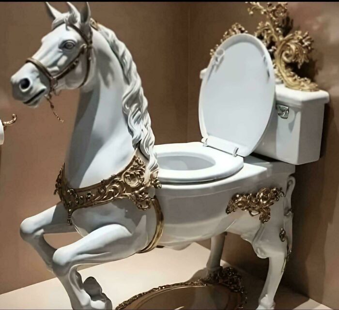 Toilet designed as a white horse with ornate gold decorations, blending ridiculous home decor with a DIY artistic concept.