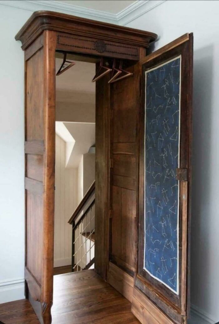 Vintage wooden wardrobe with constellation design on door panel in a home decor setting with ridiculous DIY elements