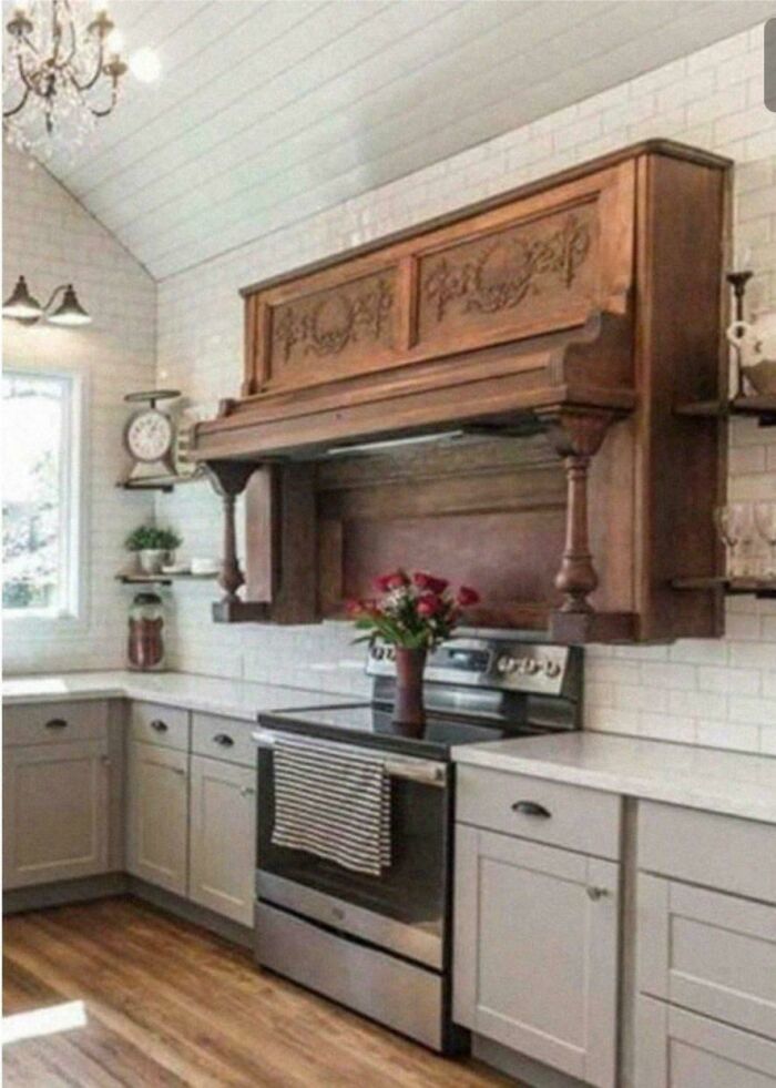Kitchen with vintage piano repurposed as a unique range hood in a home decor DIY project with sarcastic charm.