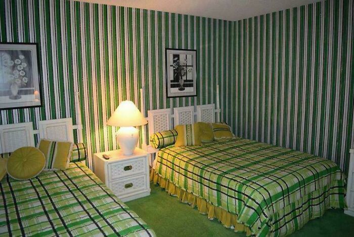 Bedroom with clashing green striped wallpaper and matching plaid bedspreads showing ridiculous home decor and DIY style