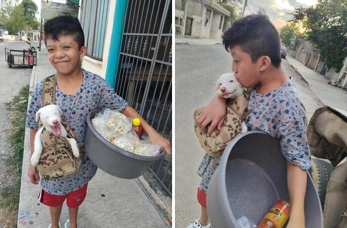 Smiling boy carrying a puppy in a bag and a basin, showcasing a beautiful bond between humans and animals on the street.