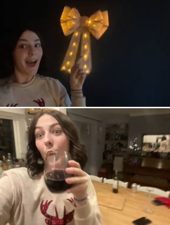 Woman in holiday sweater taking funny selfies, capturing the chaotic energy of a mom on social media with a glowing bow and wine.