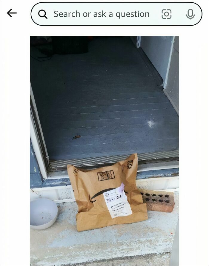 Crumpled package left at doorstep as a funny delivery confirmation pic shared by a driver to customers.