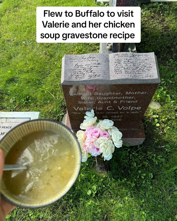 Woman tracks down recipes etched on tombstones holding a bowl of chicken soup near a gravestone with recipe inscription.