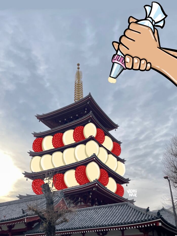 Traditional pagoda building creatively transformed with cartoon-style cream and berry decorations by artist.