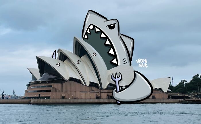 Sydney Opera House with cartoon shark illustration added, showcasing artist turning everyday places into creative cartoon scenes.