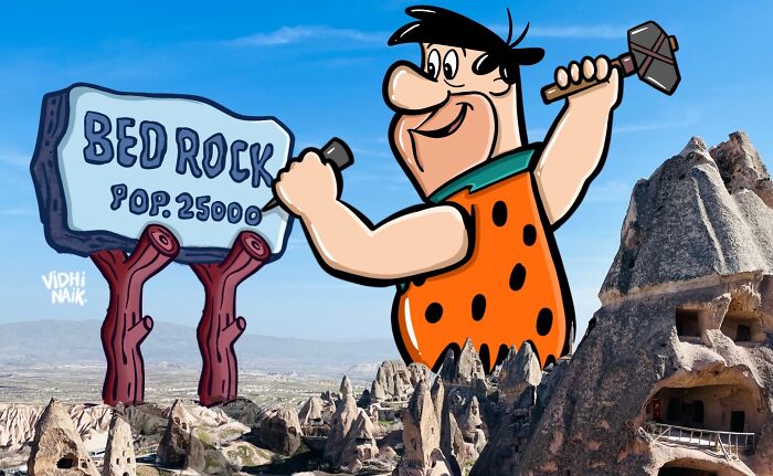 Cartoon artist transforms rocky landscape into a Flintstones-inspired scene with Bed Rock sign and animated character.