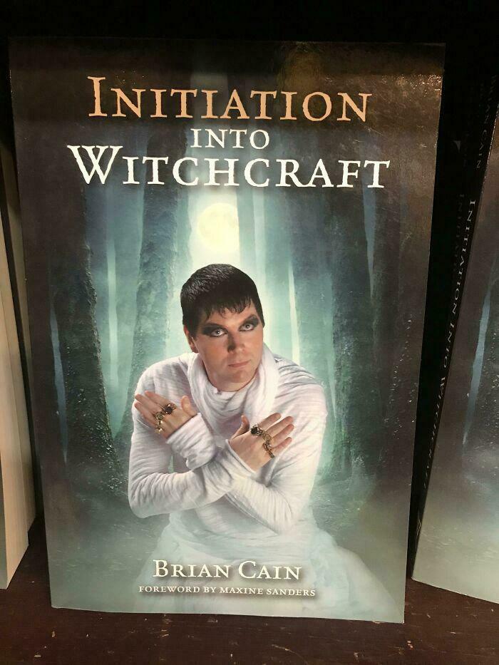 Book cover of Initiation into Witchcraft by Brian Cain with a person in white robes posing in a mystical forest setting for terrible book covers.