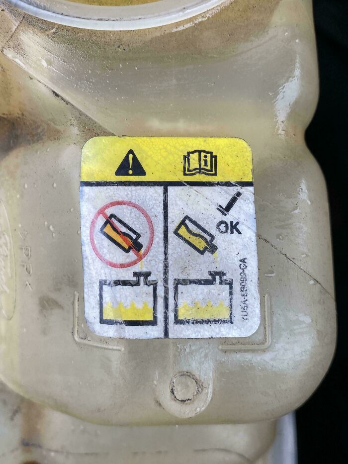 A warning label with confusing symbols, a design fail that should have never been approved.