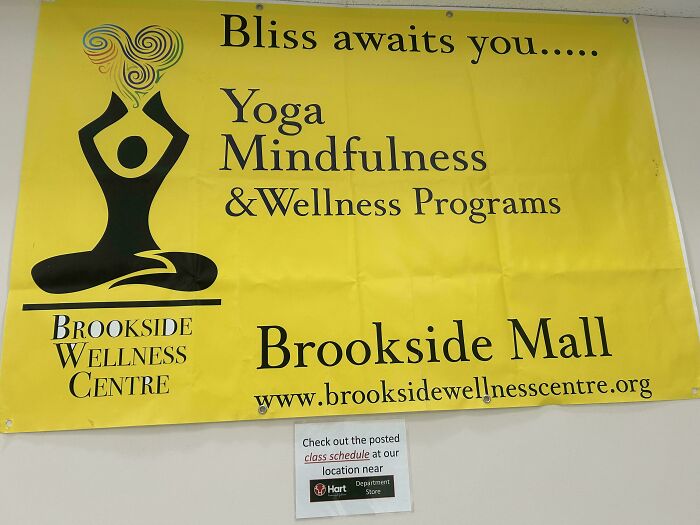 A yellow banner promoting Yoga Mindfulness & Wellness Programs, a design fail with cluttered text and uneven layout.