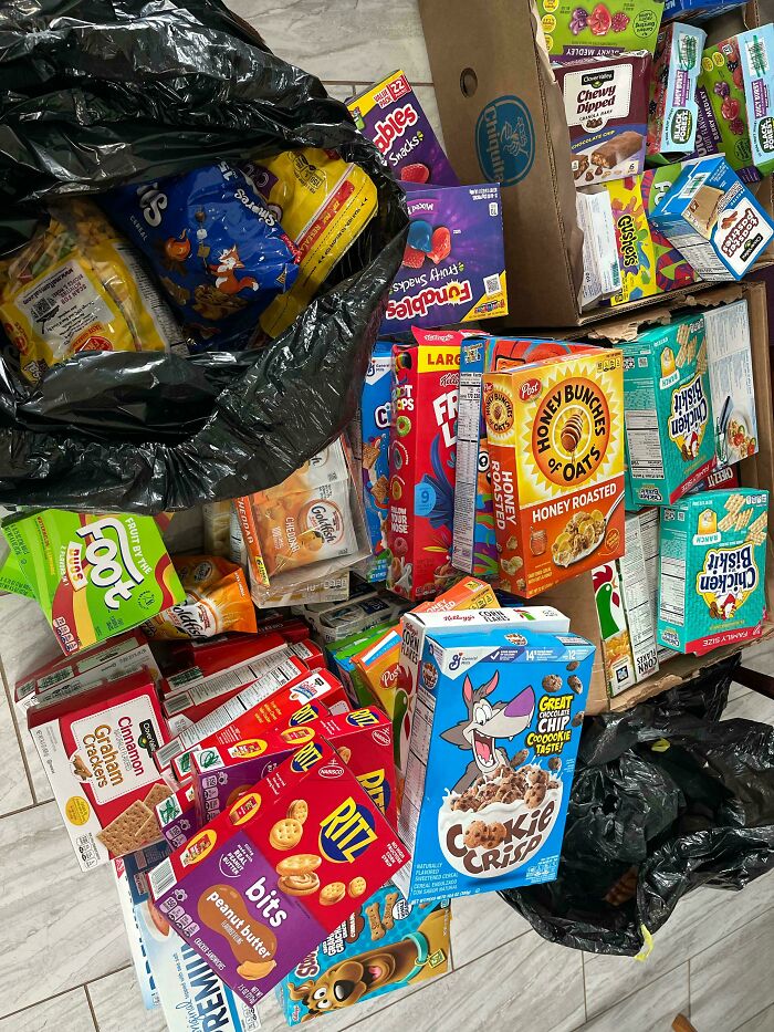 An assortment of cereal boxes and snacks, a generous find while dumpster diving.