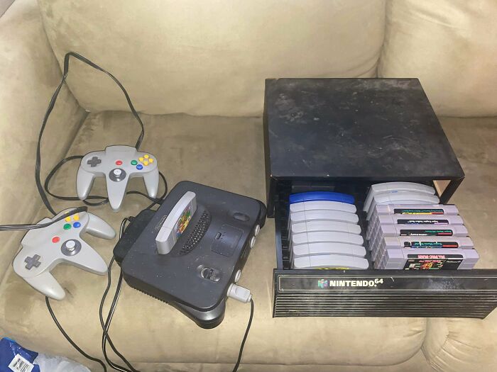 A vintage Nintendo 64 console with two controllers and several game cartridges, a great dumpster diving score.