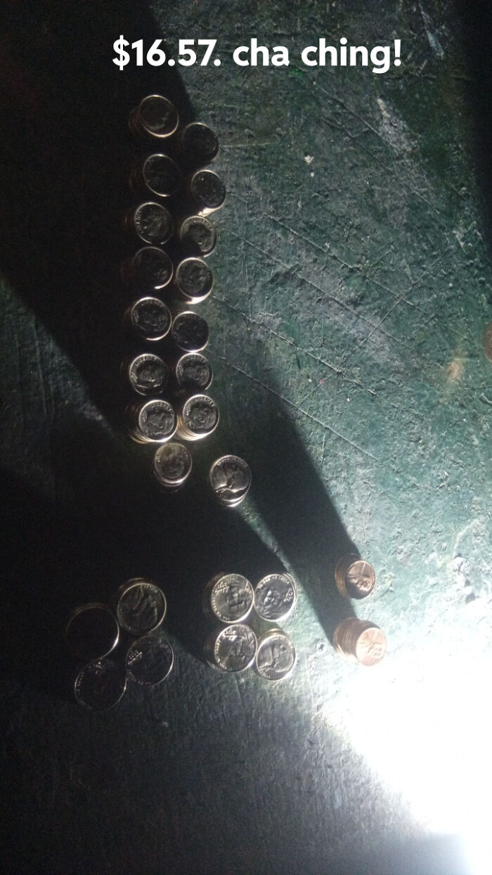 Various stacks of coins, primarily dimes, totaling $16.57, representing a monetary stroke of luck from dumpster diving.