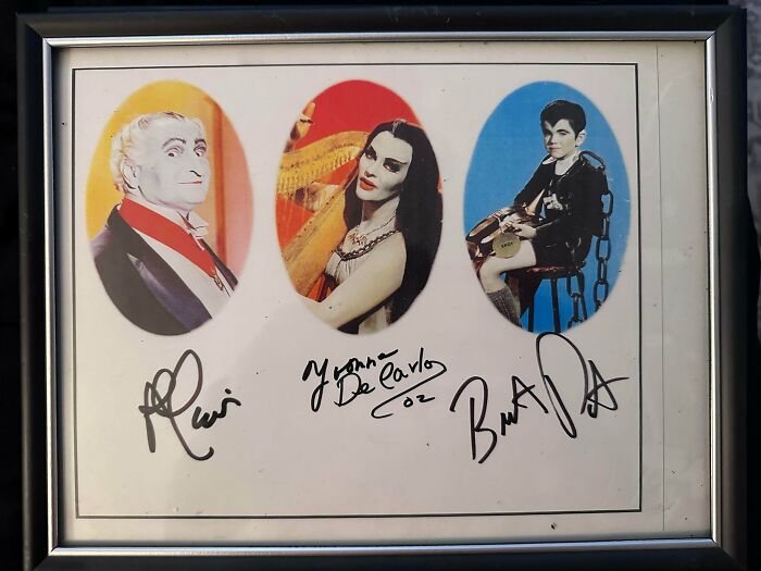 A framed picture featuring three classic TV characters with signatures, a lucky find while dumpster diving.