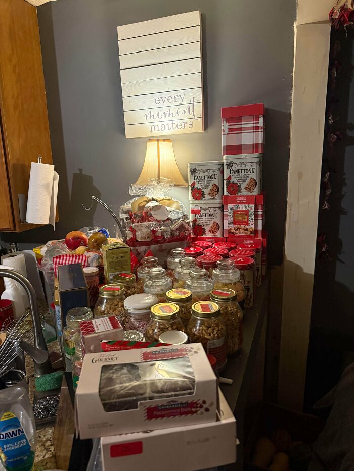 A table full of food items, including jars, boxed goods, and bread, a lucky find while dumpster diving.