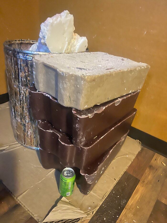 Large blocks of wax and a metal bucket, items that people couldn't believe their luck finding while dumpster diving.