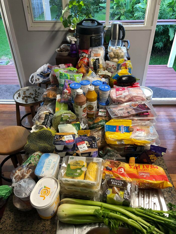 A massive haul of groceries, including fresh produce and packaged goods, found while dumpster diving.