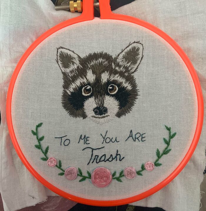 Embroidered raccoon with floral design and funny Valentine’s Day gift message showing true love and humor.