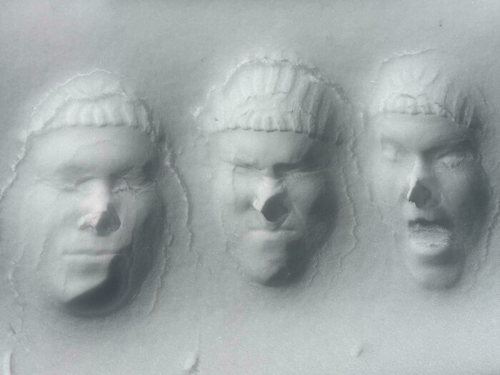 Three faces pressed into white material, creating interesting pictures.