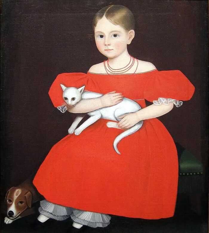 Young girl in a red dress holding a white cat in a classic cat-themed artwork from history.