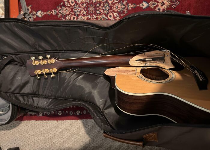 Forced To Gate Check Guitar, Got It Back Split In Half