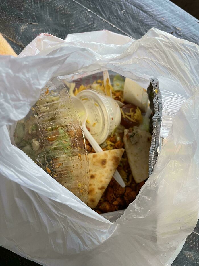 Discarded food and containers in a plastic bag illustrating selfish behavior and inability to work with others.