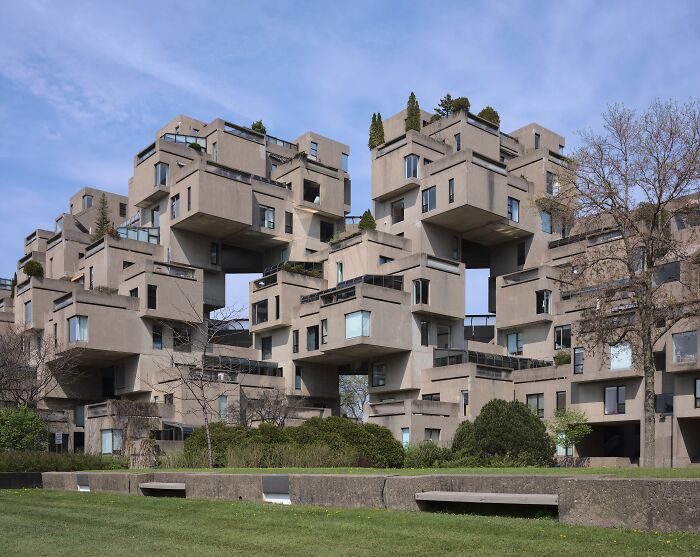 Unusual places featuring unique architectural design with interlocking concrete structures and greenery on terraces.
