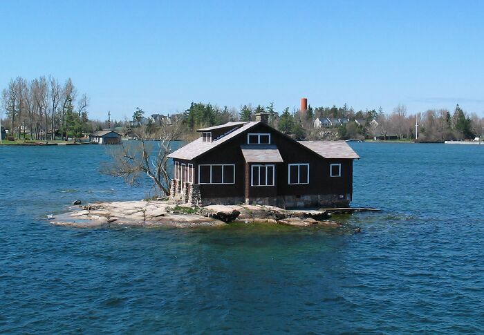 Small unique house on a rocky island surrounded by water, one of the unusual places around the world with its own Wikipedia page