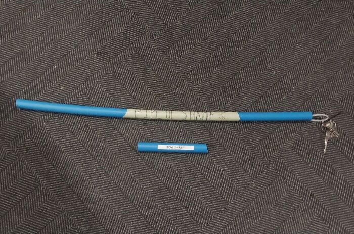 Blue pool noodle with keys attached labeled not for some, placed above a shorter blue piece labeled towel act, illustrating selfishness.