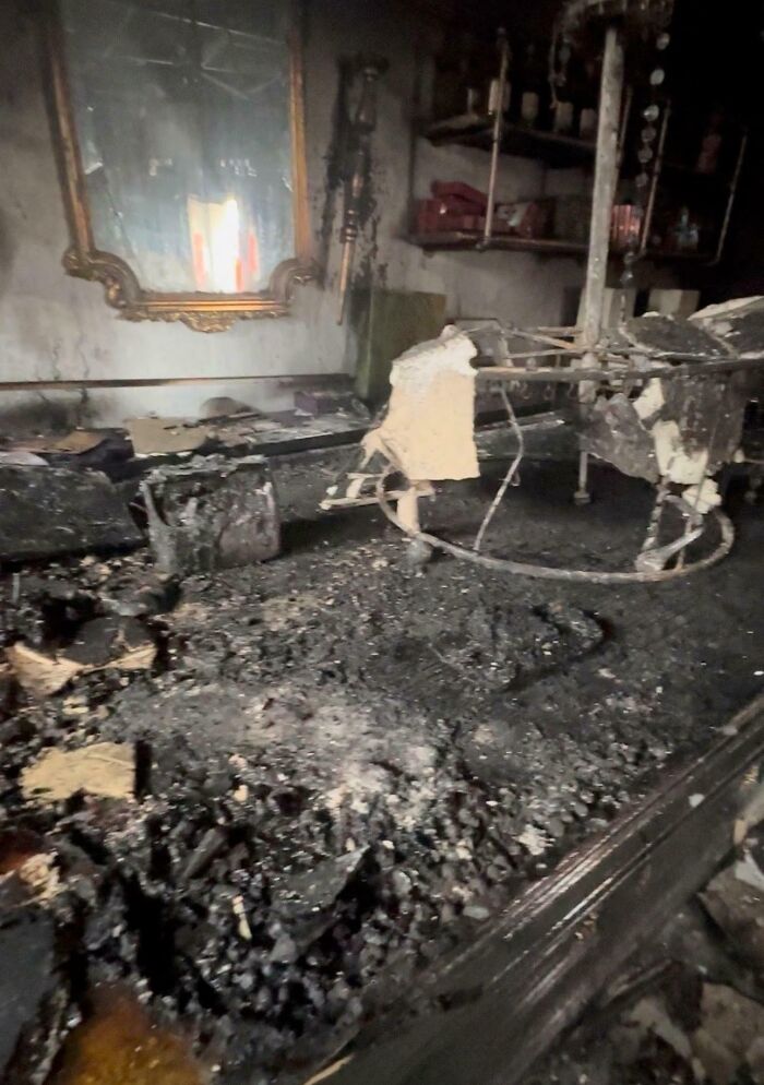Severely burnt and charred room showing aftermath of fire, illustrating tech support workers wishing for different profession.
