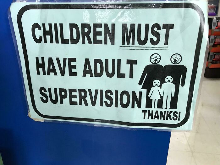 Sign warning children must have adult supervision, featuring spooky eyeball heads, related to scary signs spotted in the wild.