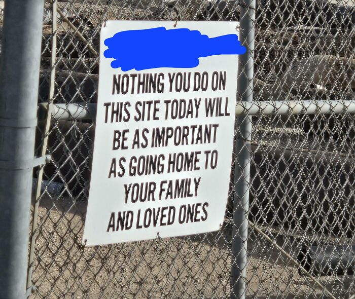Warning sign on chain link fence emphasizing importance of going home to family, part of scariest signs spotted in the wild.