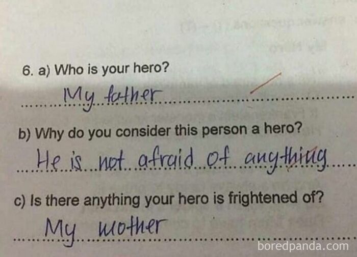 Handwritten answers on a quiz showing a humorous chaotic marriage meme about hero fear involving mother and father.