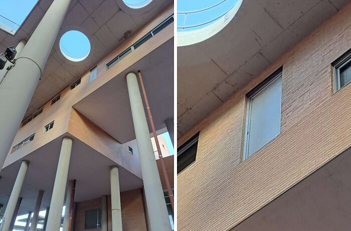Architectural fail showing a door leading nowhere high above ground on a modern building with pillars and skylights.