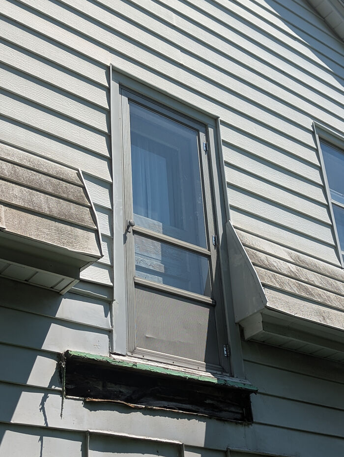 Door on house exterior with no stairs or balcony, an example of architects fail with doors that lead absolutely nowhere.