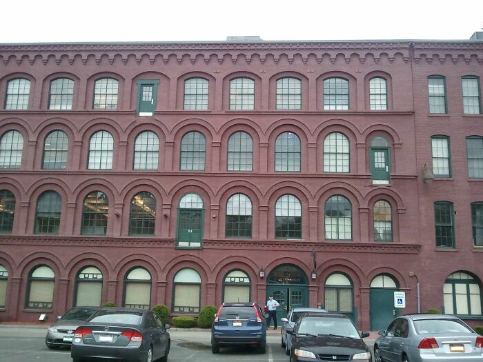 Brick building with multiple doors that lead absolutely nowhere, showcasing a major architect failure in design.