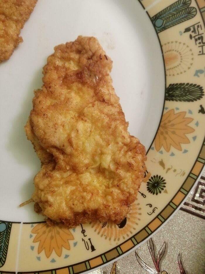 Fried food shaped like a continent on a decorative plate, highlighting funny and silly geography memes.