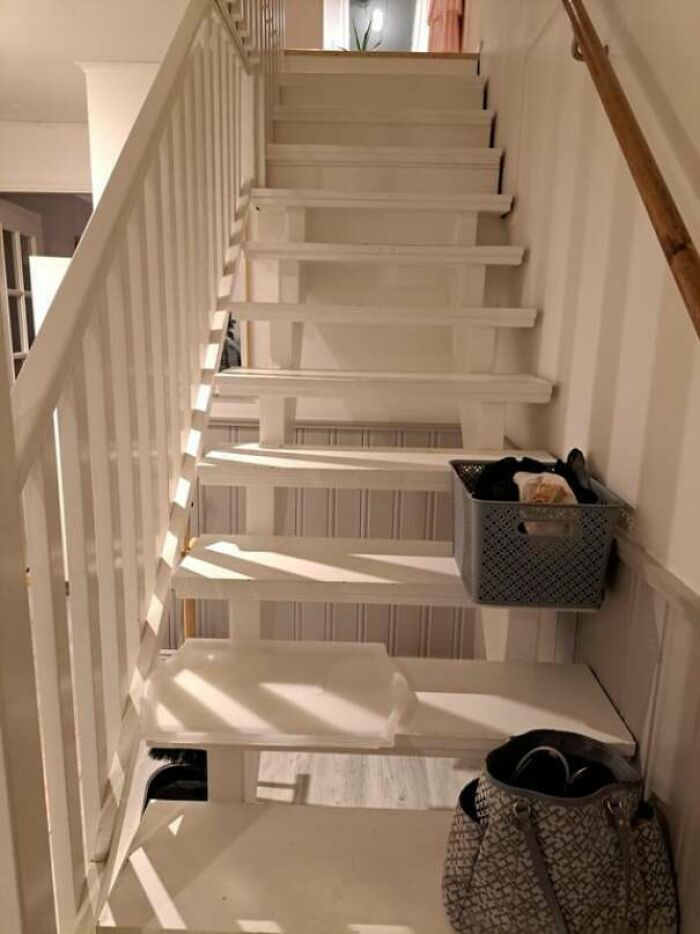 White staircase with missing steps causing frustrating habit hazards, showcasing partners’ most ridiculous habits in homes.