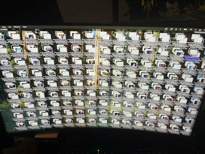 Cluttered computer desktop filled with hundreds of photo files showing partners’ most frustrating habits.