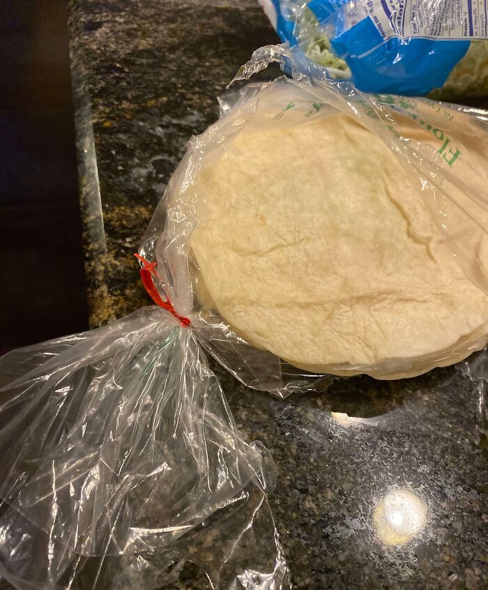 Unopened tortillas left in the bag tied with a twist-tie on a kitchen counter, illustrating frustrating partner habits.
