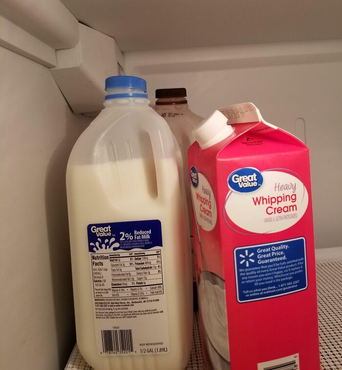 Fridge photo showing milk jug and whipping cream carton placed awkwardly, illustrating frustrating partner habits.