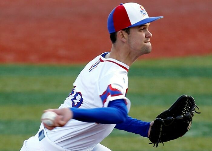 Baseball player pitching on a field, capturing a moment that resulted in a better photo than expected.