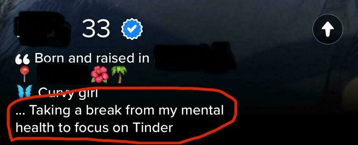 Tinder profile text humorously stating taking a break from mental health to focus on Tinder with emojis and age 33 visible.