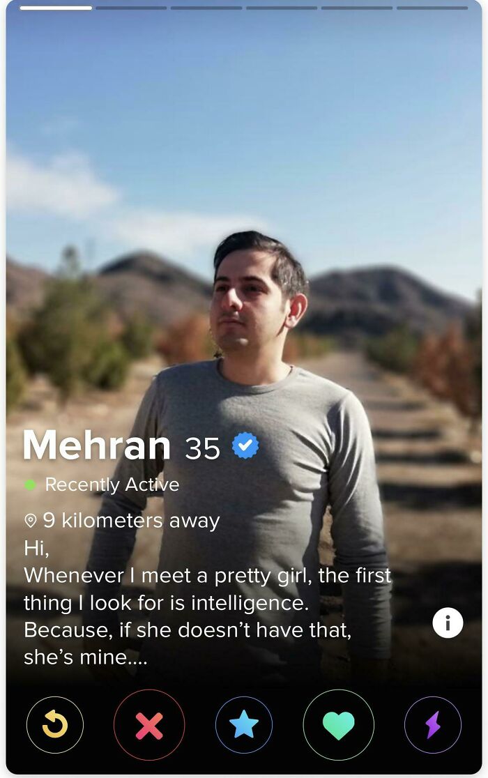 Man in gray shirt posing outdoors on a trail, featured in a Tinder profile that went off the rails.