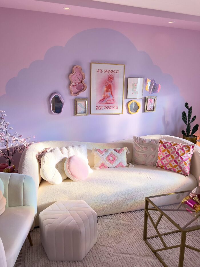 Cozy living room decked out with pastel cushions, wall art, and vibrant decor embracing more is more home design.