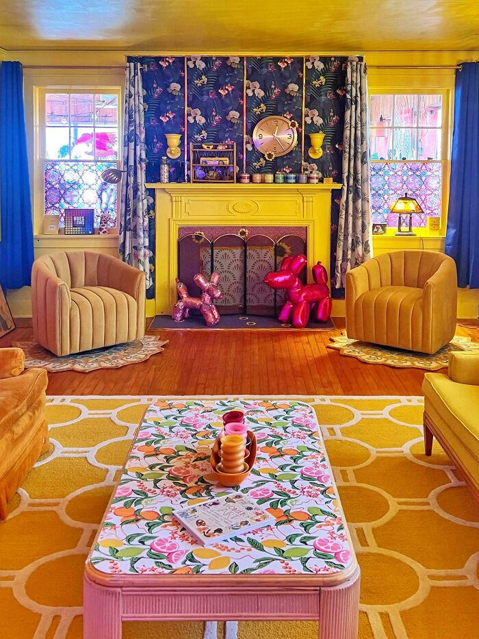 Vibrant living room embracing more is more style with bold colors, floral patterns, and eclectic home decor accents.